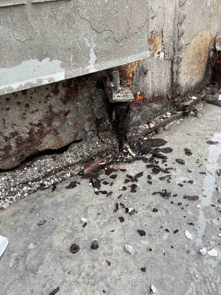 Corrosion Conundrum Or, "What the heck is that?" | through-corrosion-under-door-768x1024